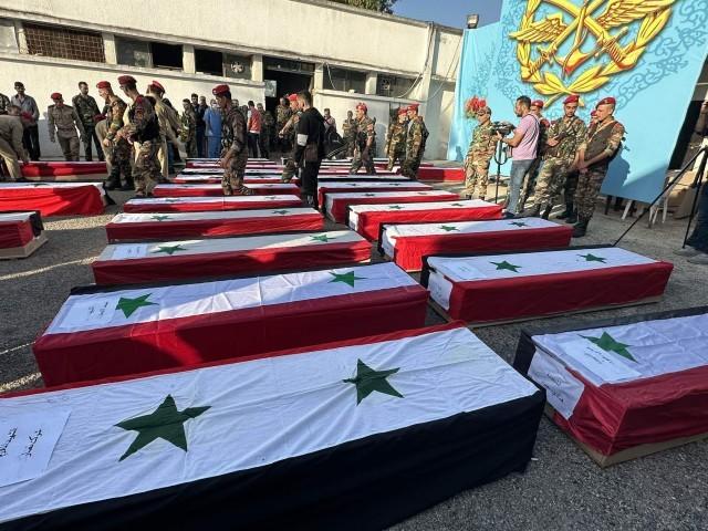 ↑叙利亚政府军为遇难者举行葬礼